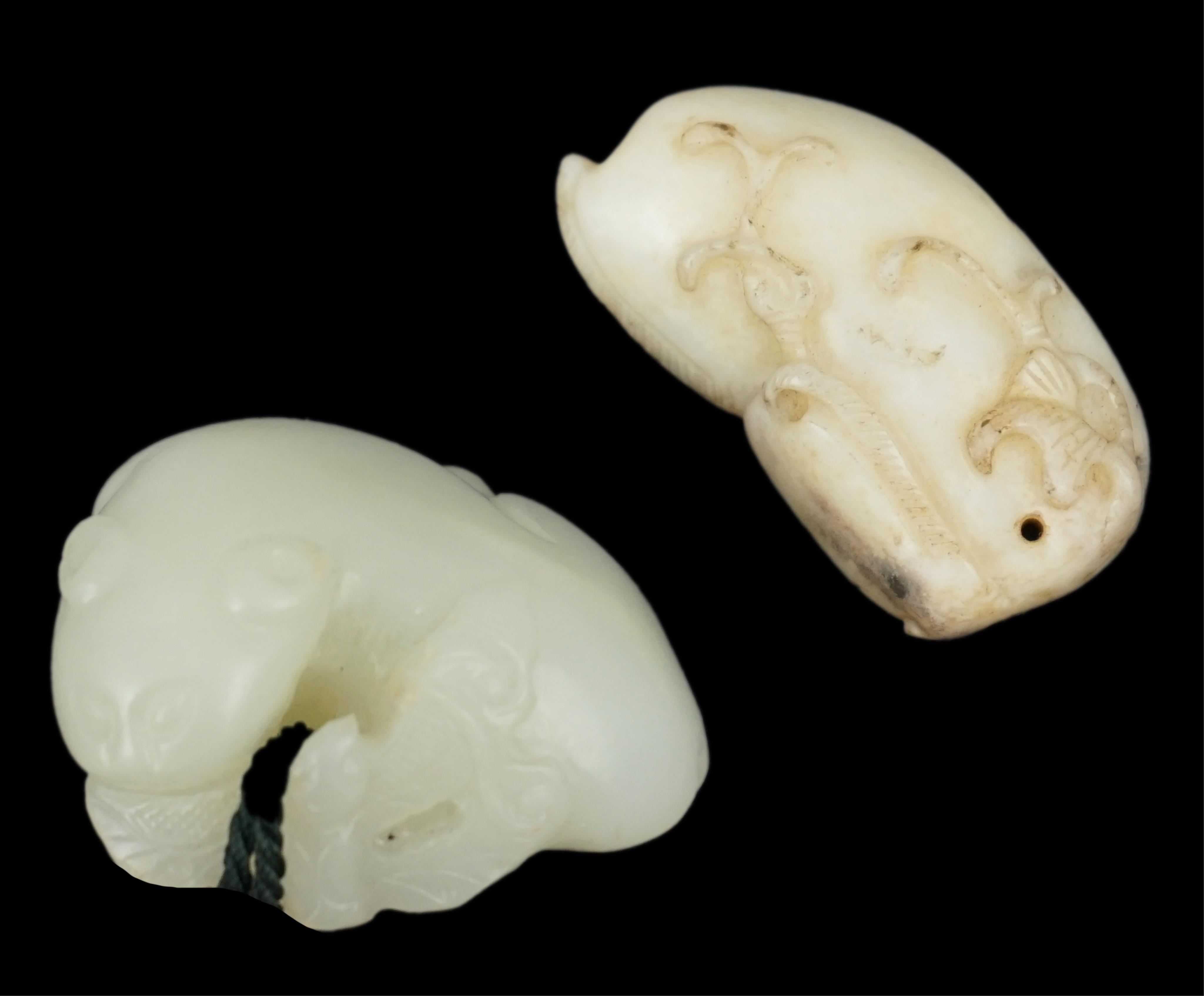 Two Chinese jade carvings, 18th/19th century including a pale jade example in the form of an animal with red wax seal, largest 4.2cm wide. Condition - good